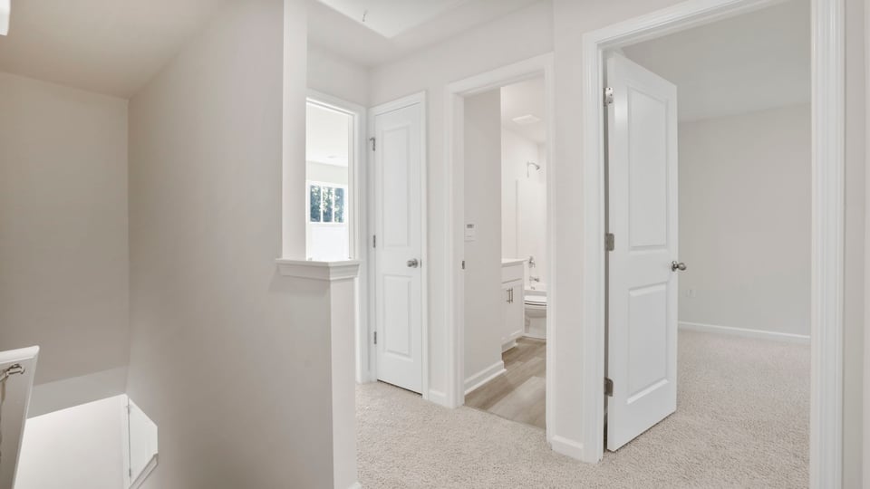 Loft area with carpet.