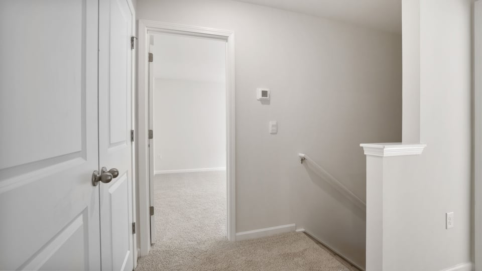 Loft area with carpet.