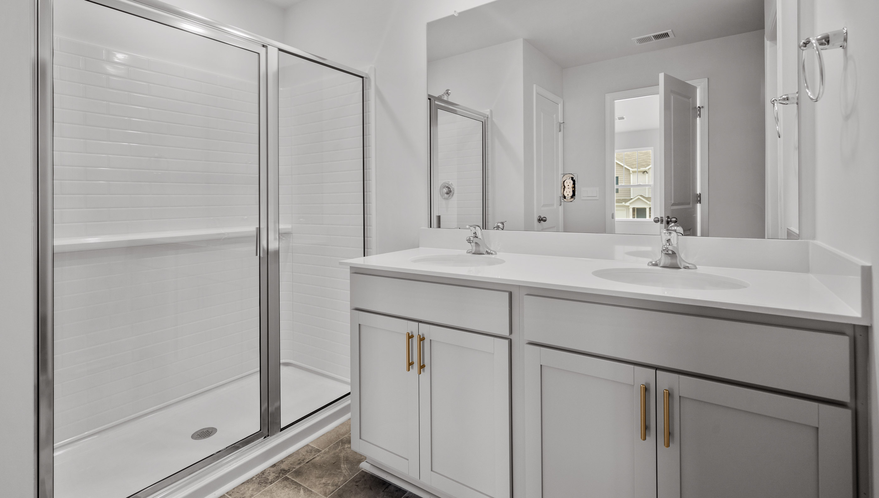 Primary bathroom with double vanity sink.