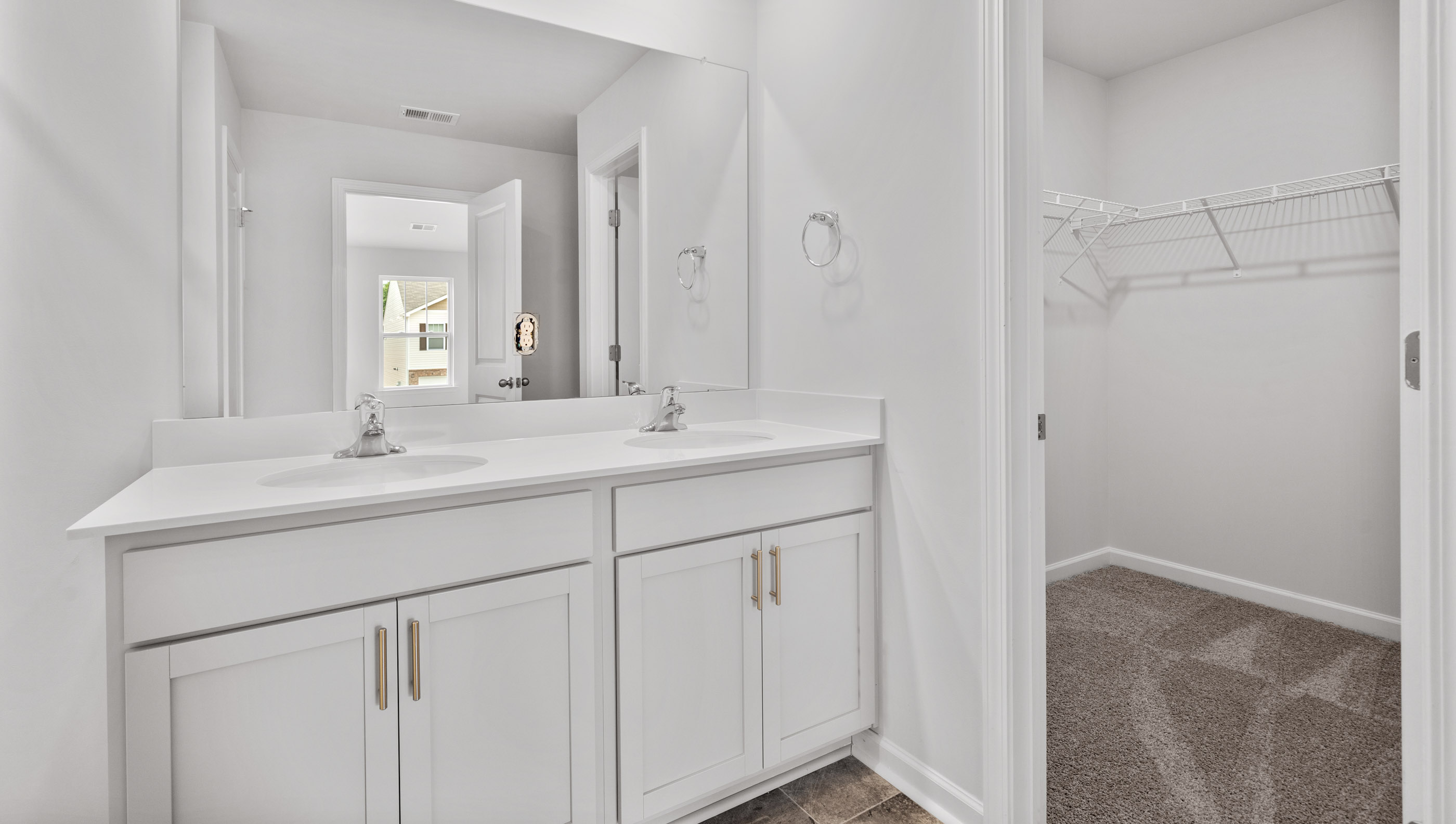 Primary bathroom with double vanity sink.