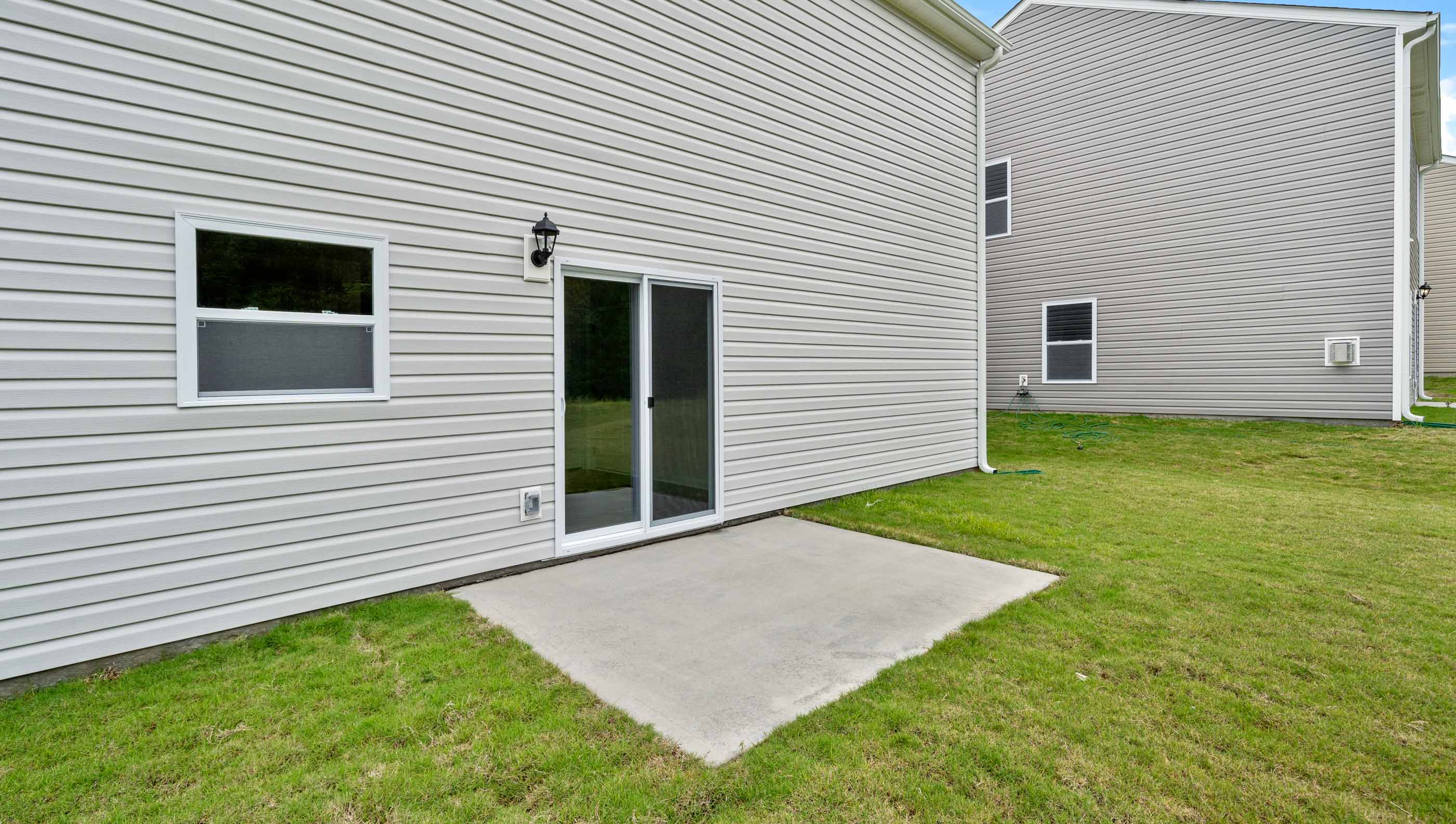 Back patio with large backyard.