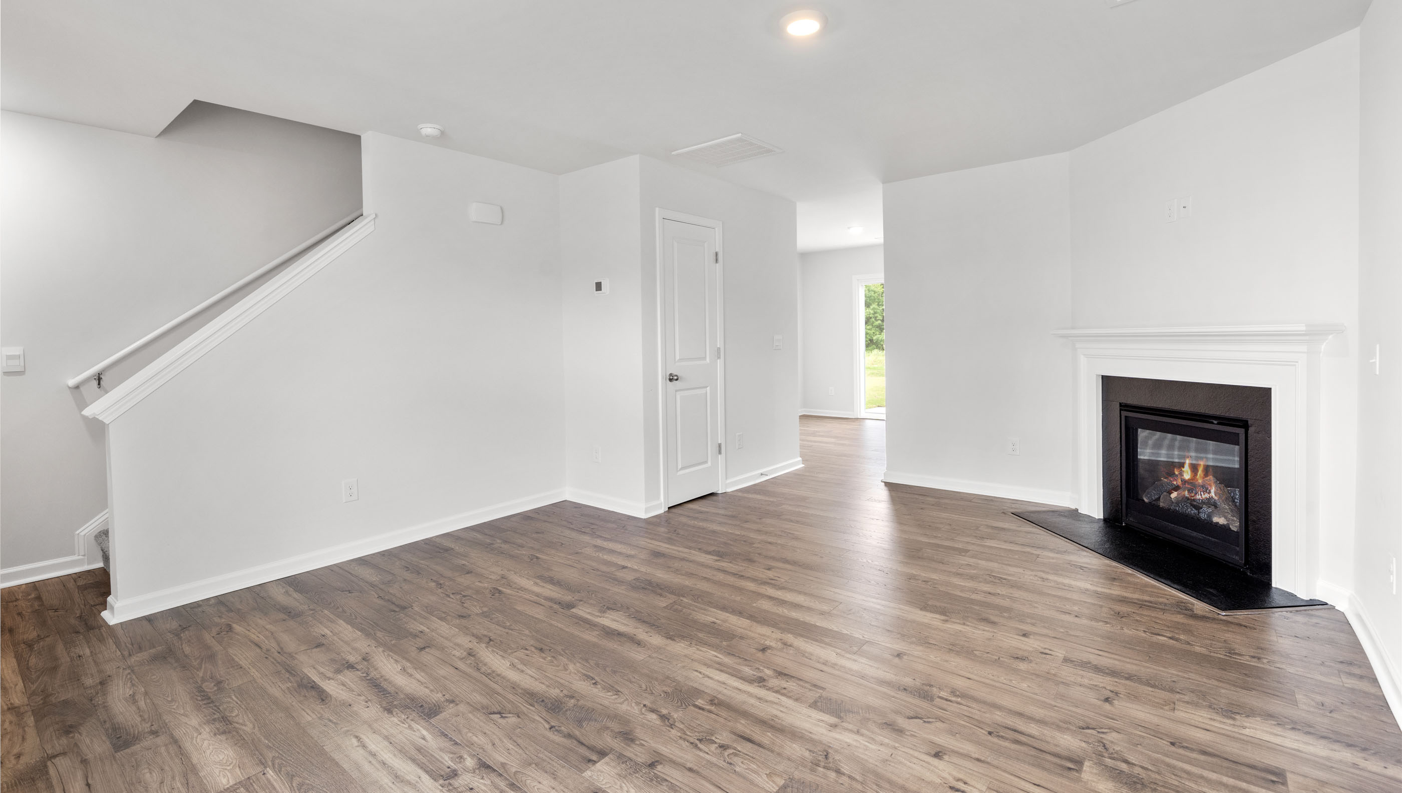 Living area with fireplace and window.