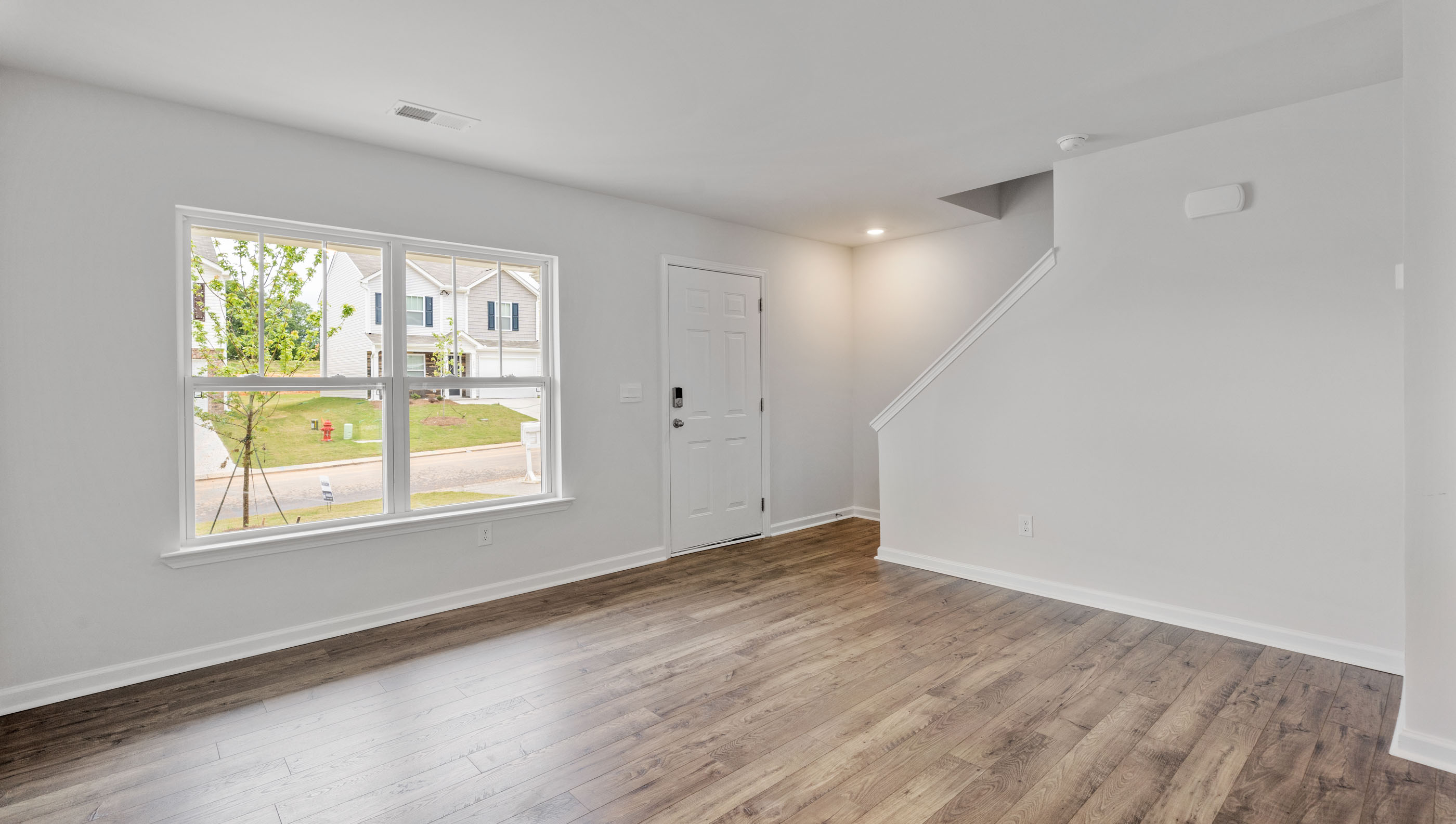 Living area with fireplace and window.