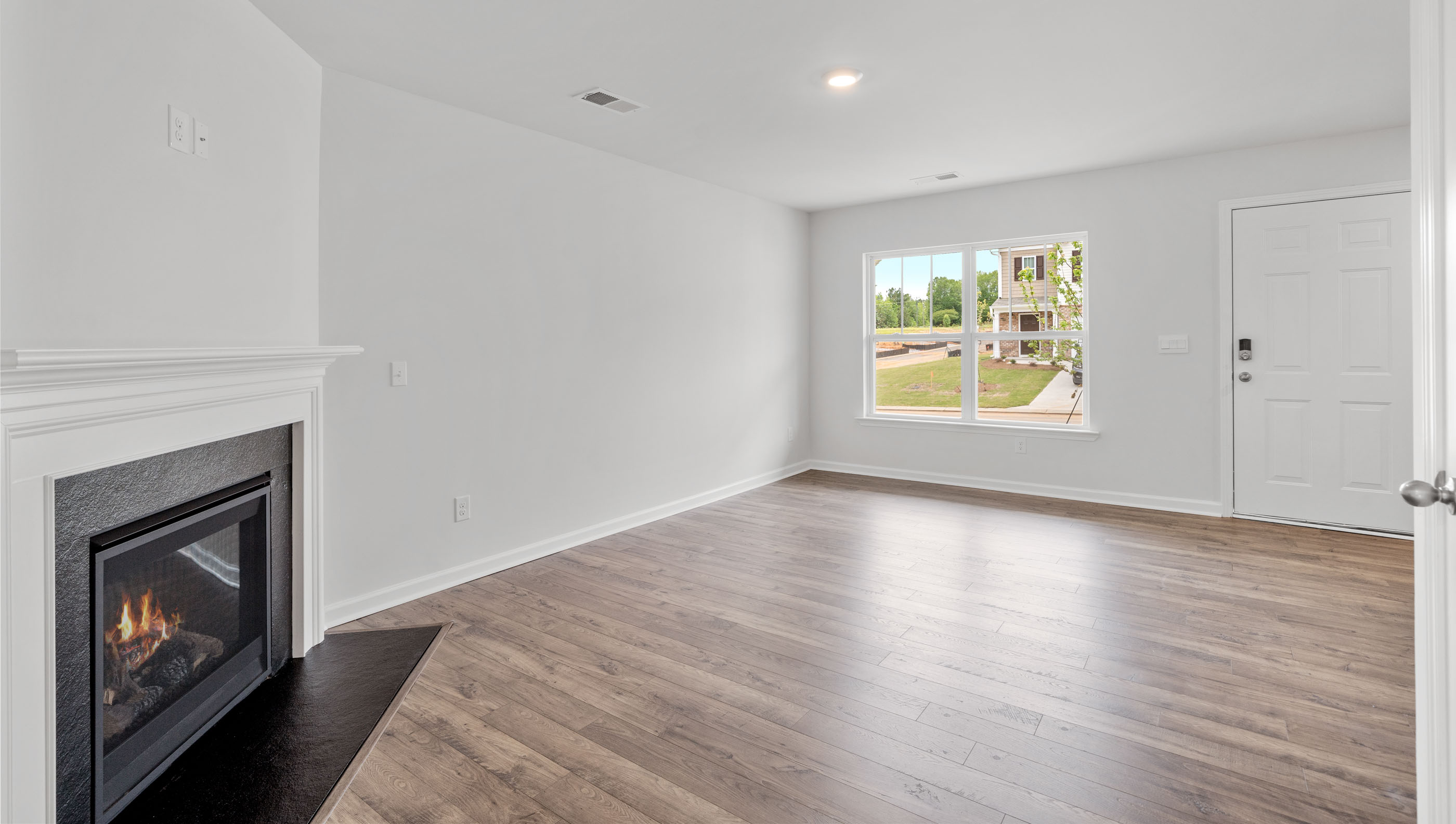 Living area with fireplace and window.
