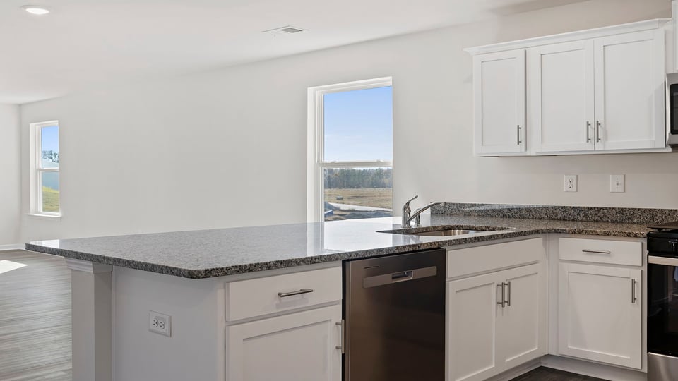 Kitchen features stainless steel appliances.