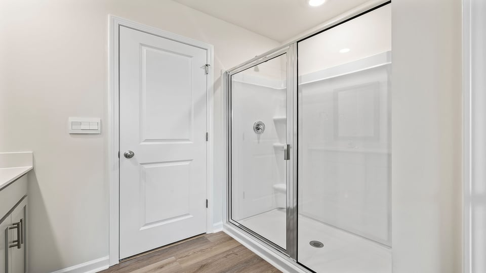 Primary bathroom with walk-in shower.