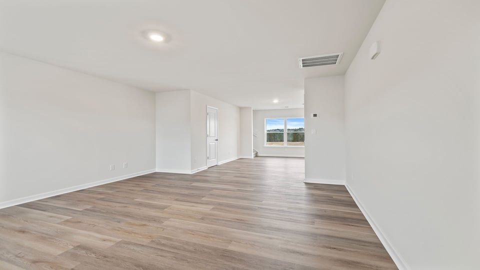 View of the family room into the dining room.
