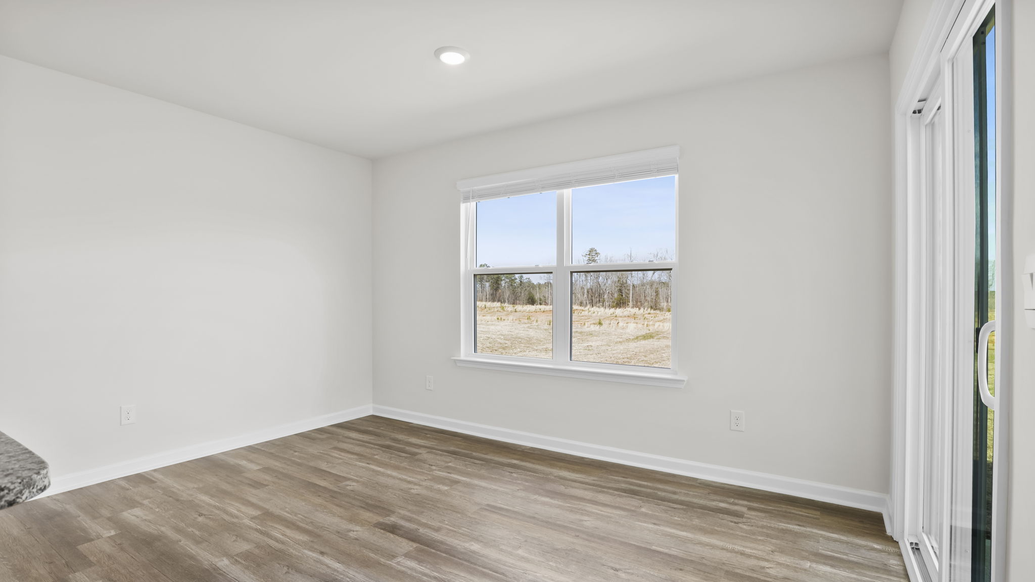 Dining area with two large windows.