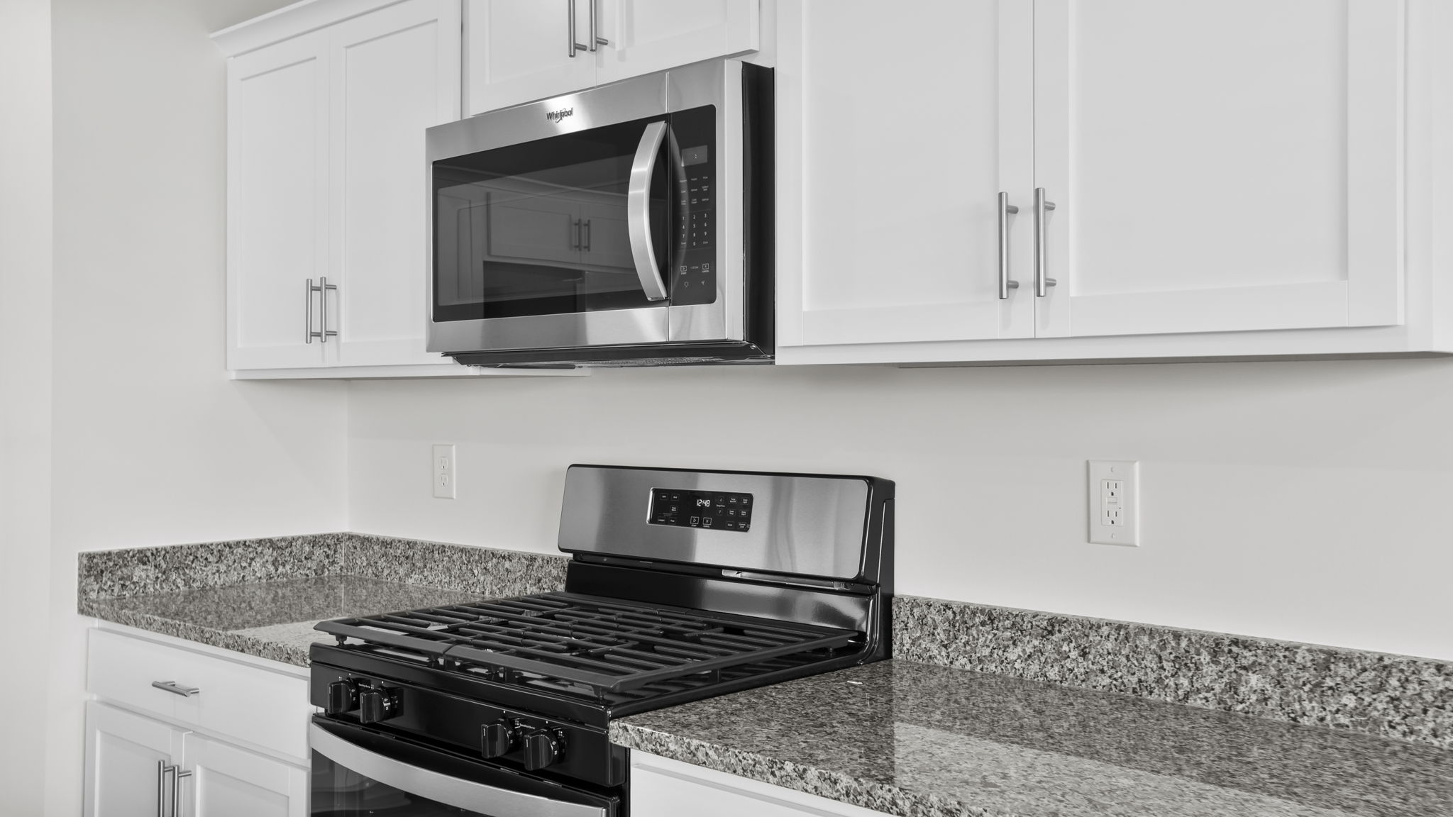 Kitchen features stainless steel appliances.