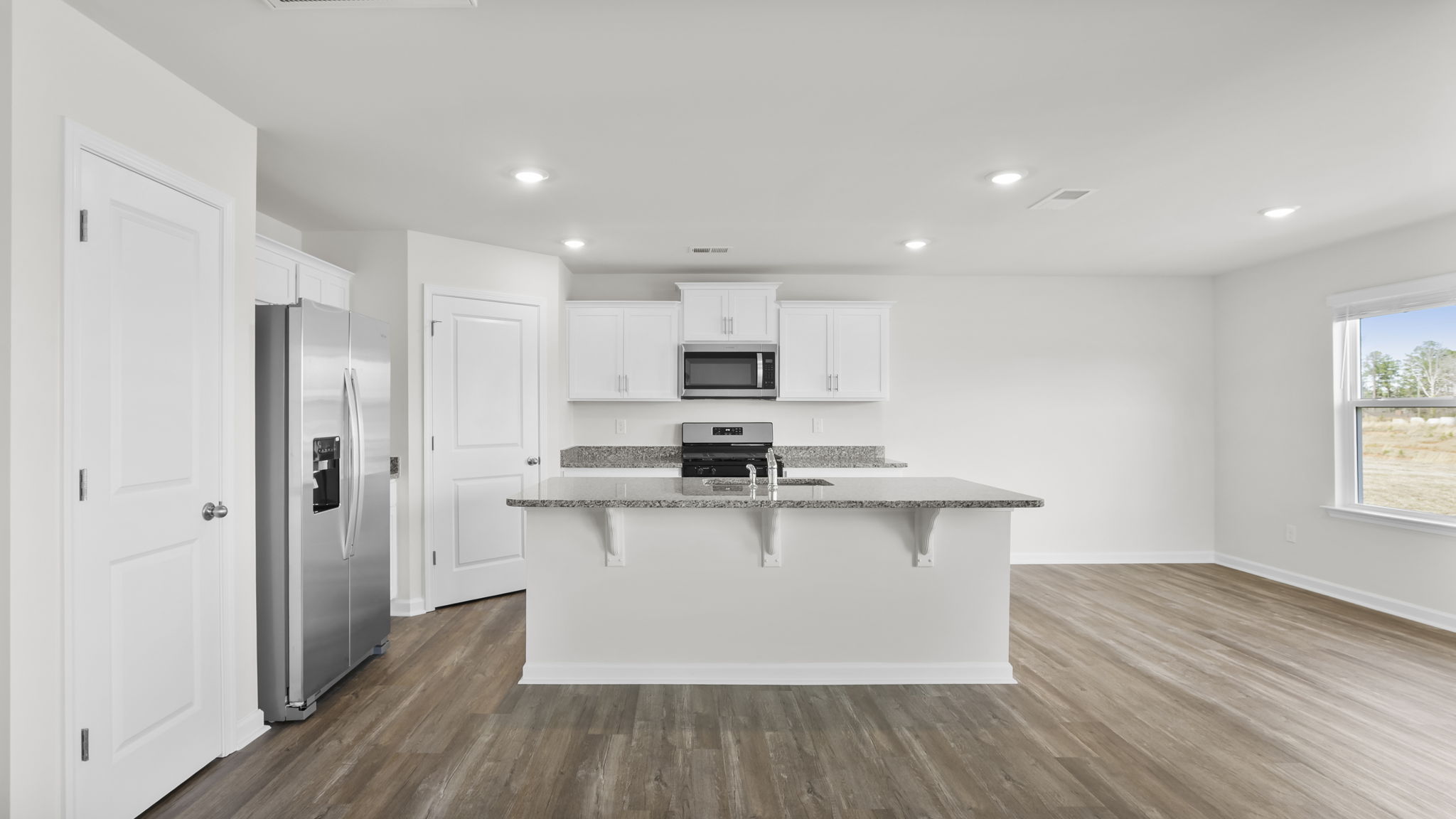 View of the kitchen and adjoining dining area.