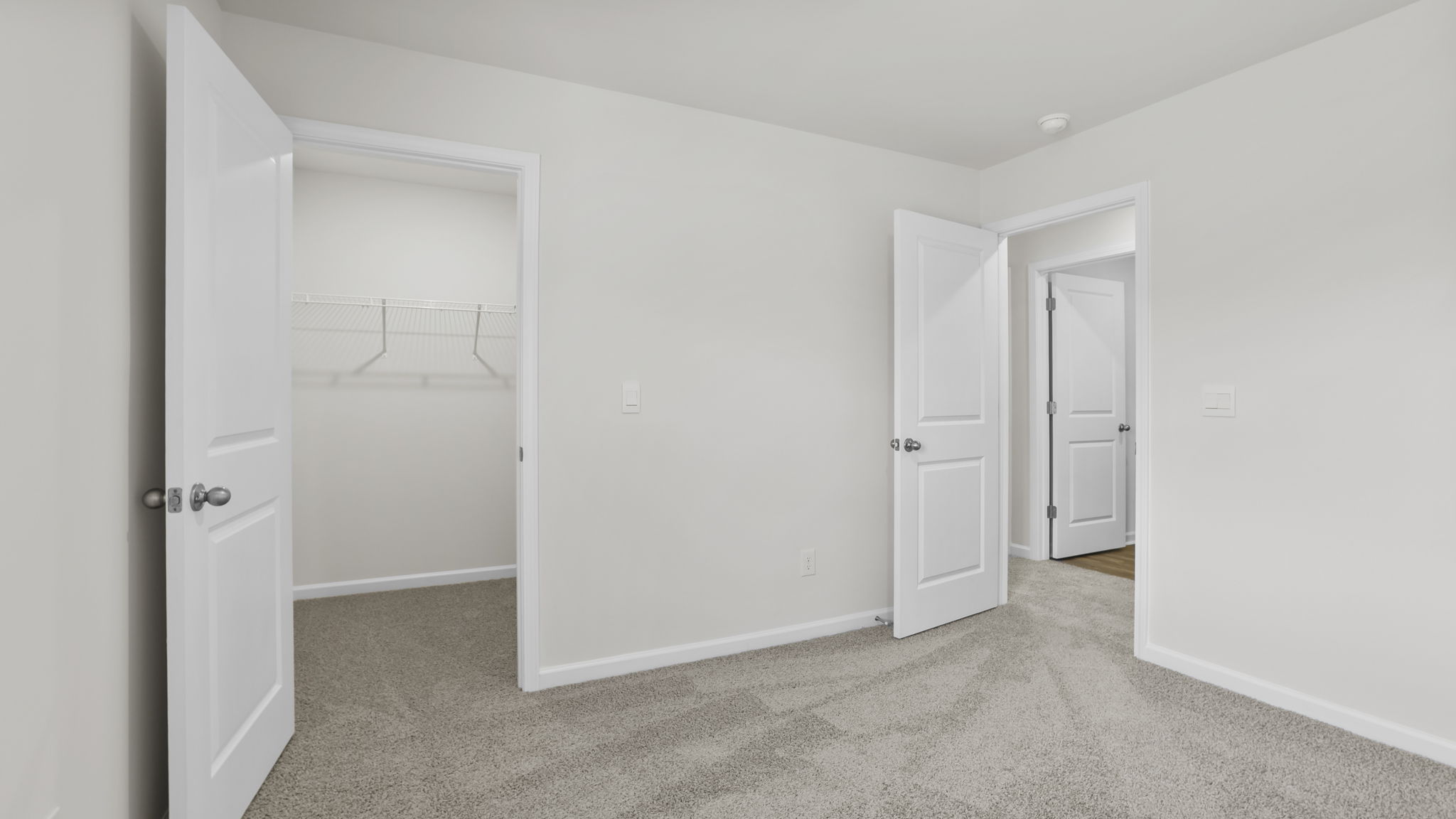 Bedroom with window and carpet.