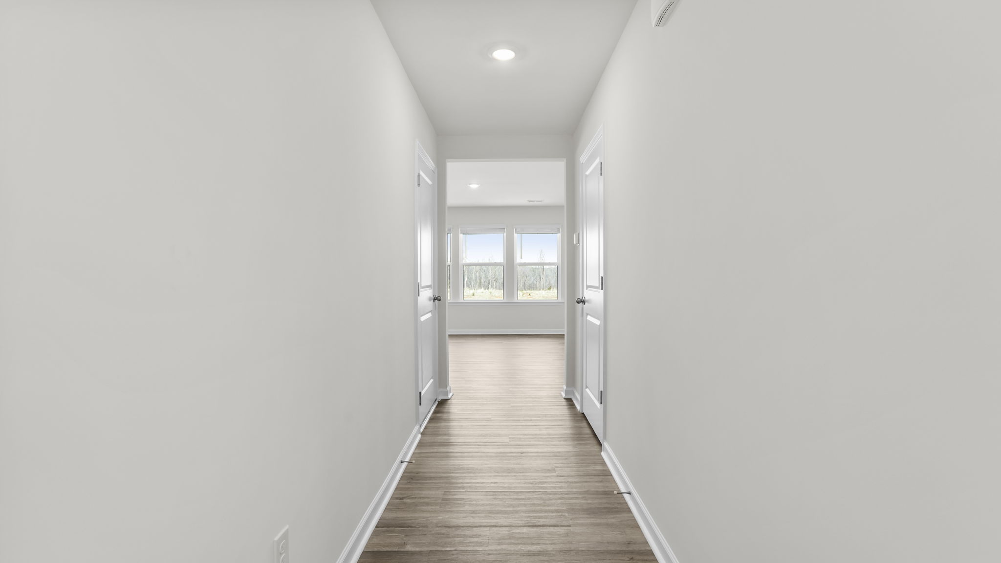 View of the hallway and windows in the living room.