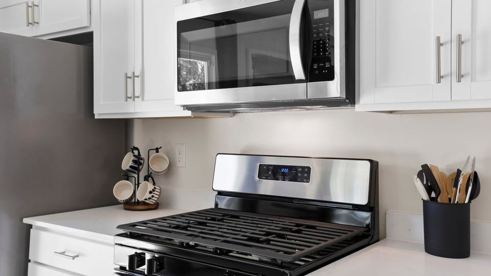 Kitchen with windows and cabinets.