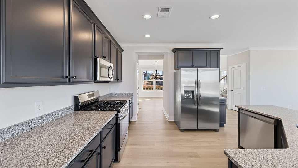 Kitchen with cabinets and island.