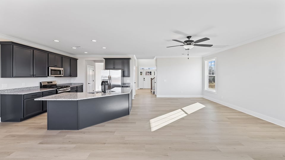 Kitchen with cabinets and island.
