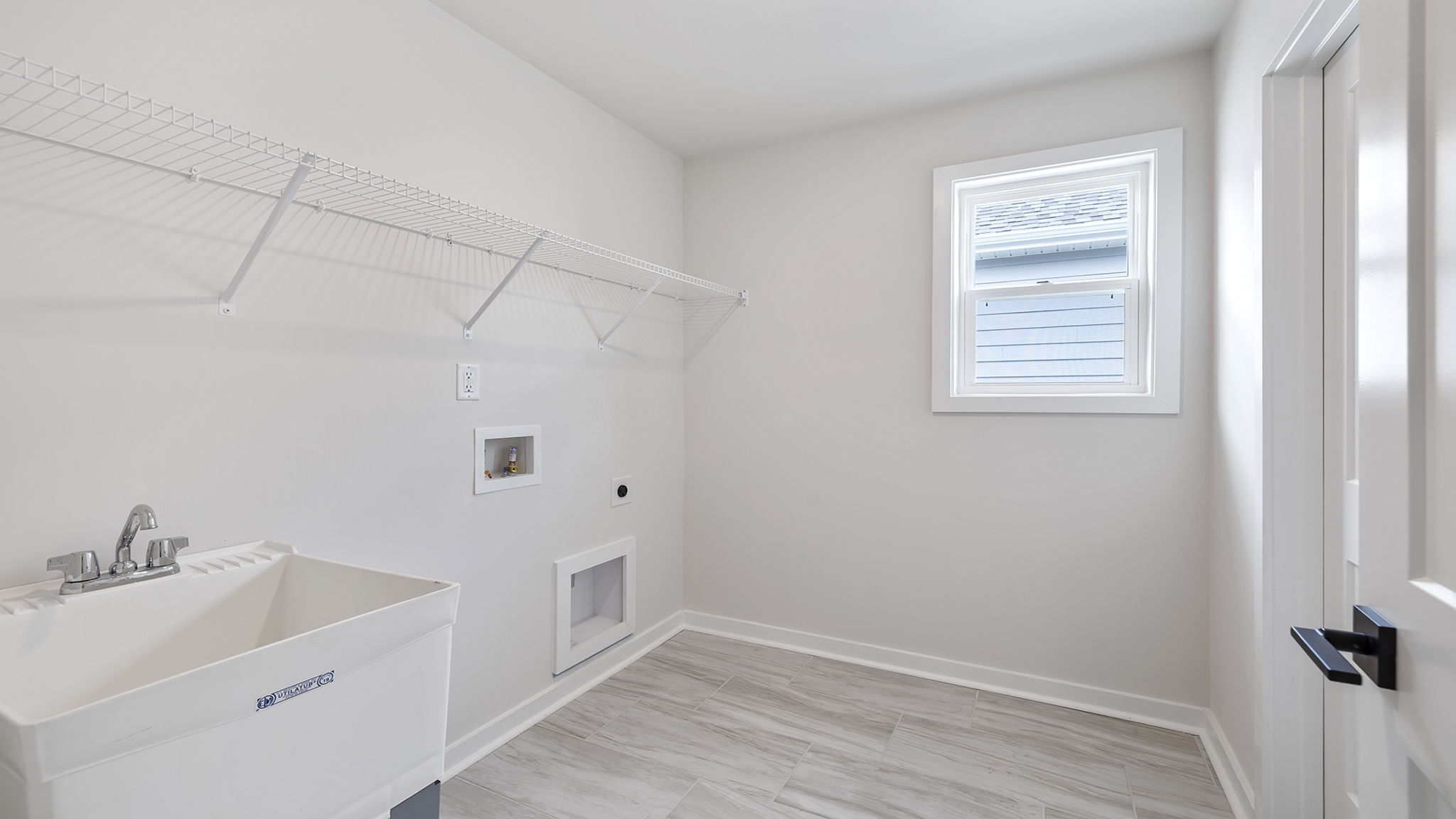 Laundry room with shelf.