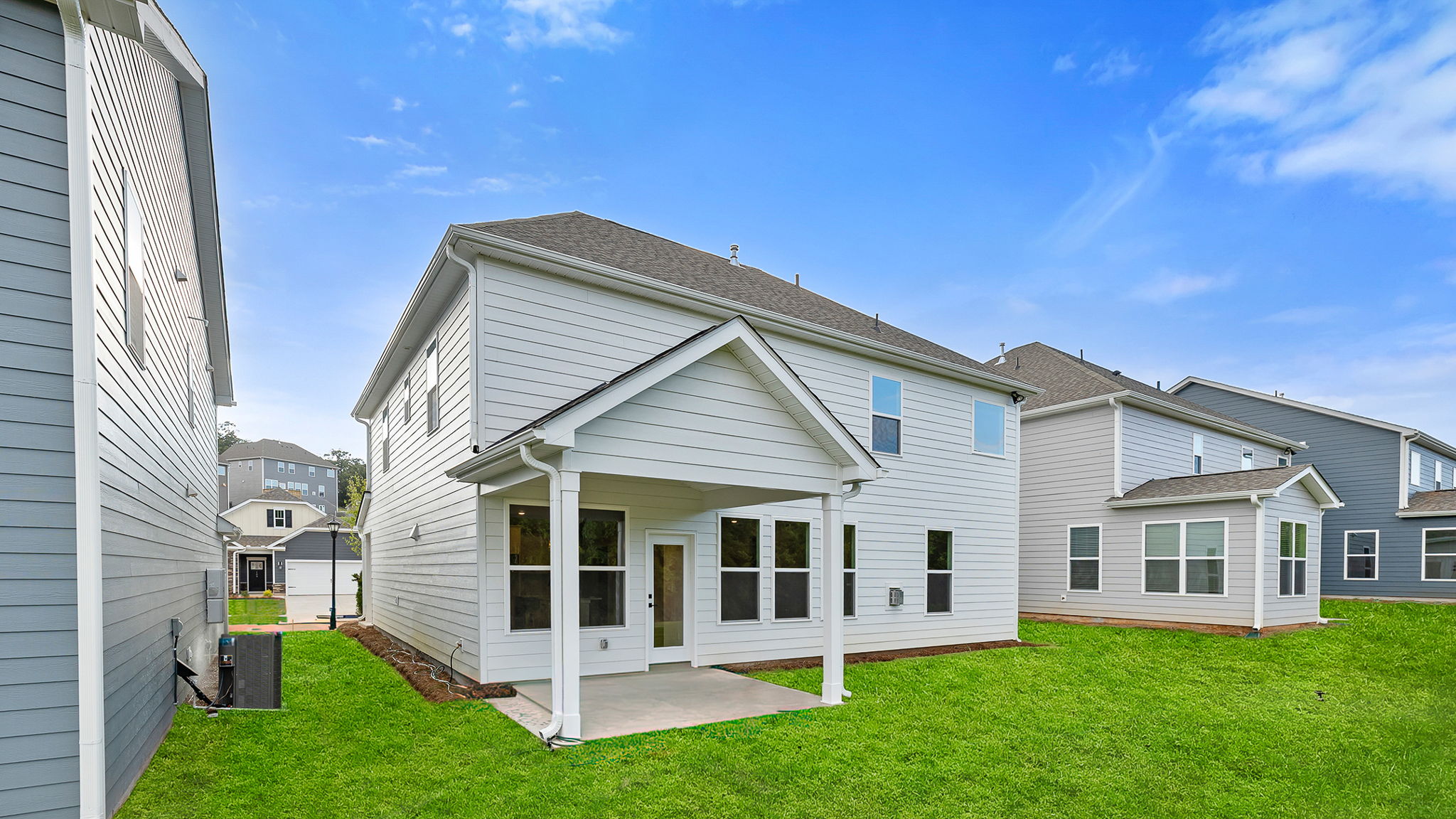 Back exterior with large backyard.