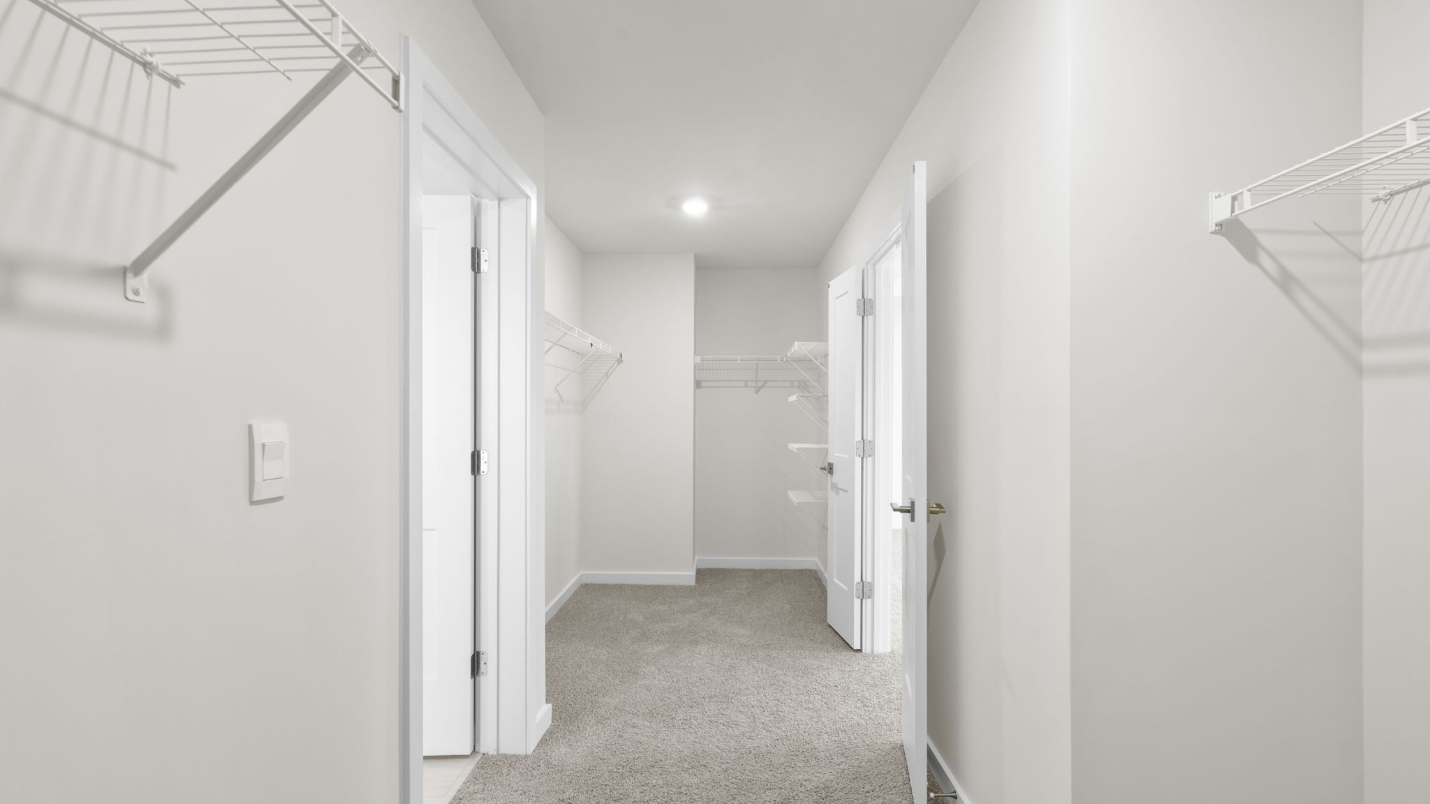 Primary bedroom walk-in closet.