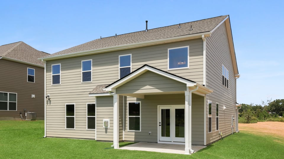 Back exterior with large backyard.
