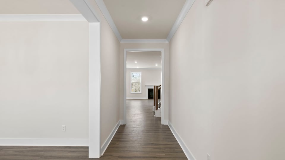 View of large hallway toward the living area and dining room.