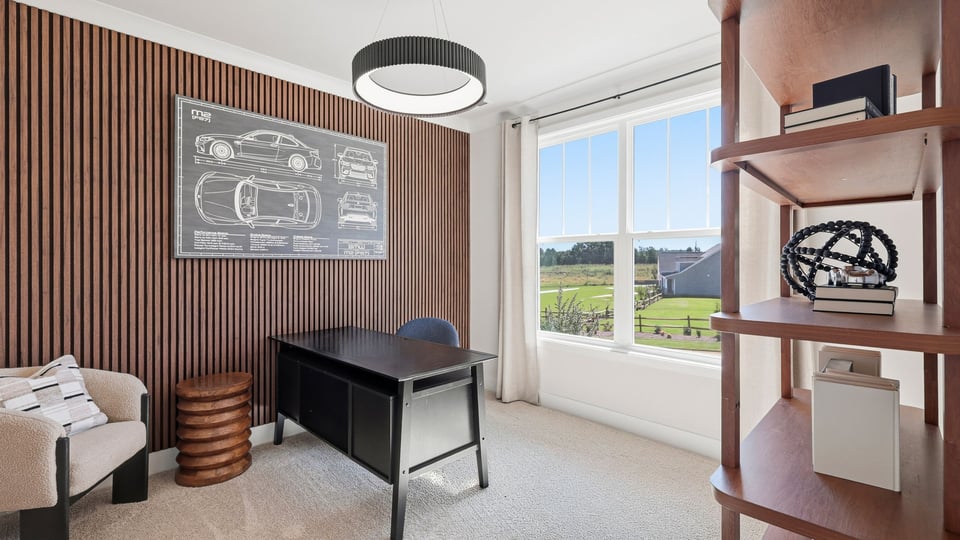 Bedroom with carpet and windows.