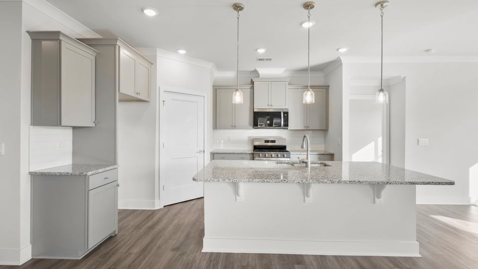 Kitchen with island and cabinets.