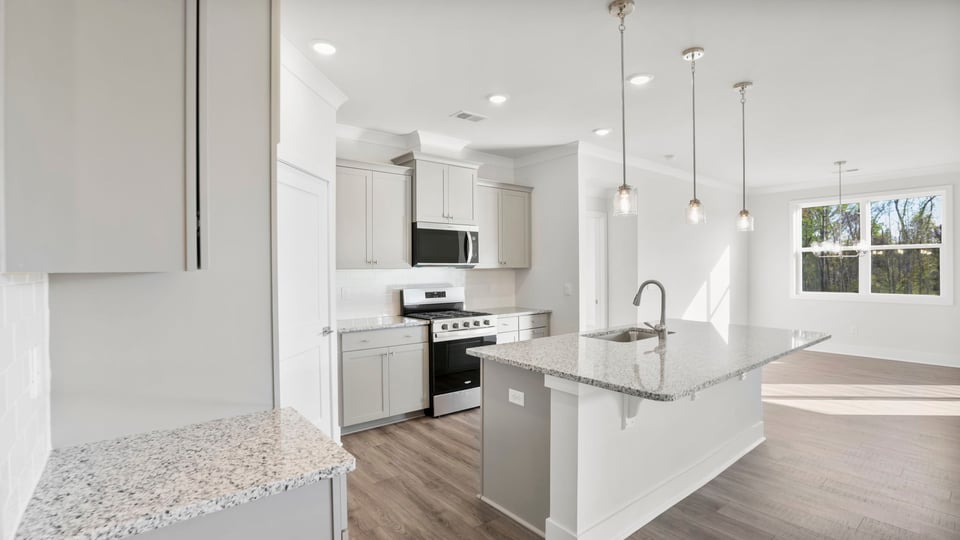 Kitchen with island and cabinets.