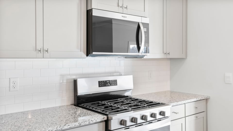 Kitchen with island and cabinets.
