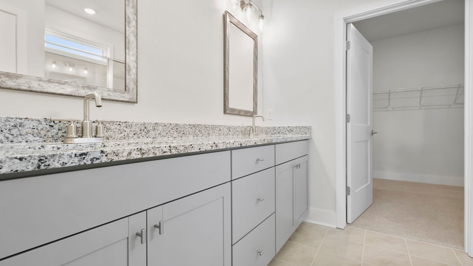 Primary bathroom with double vanity sinks.