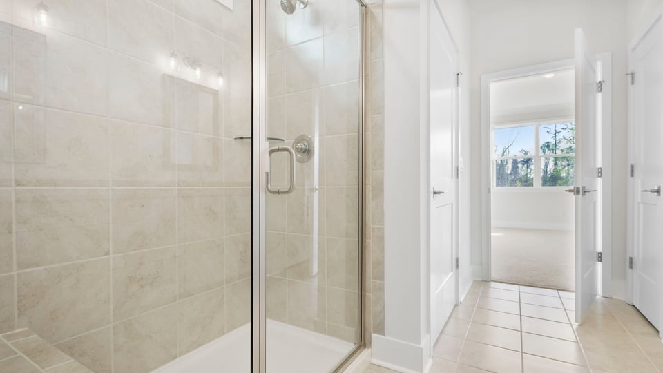 Primary bathroom with double vanity sinks.