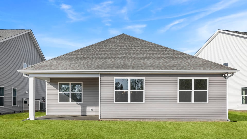 Back exterior with large backyard.