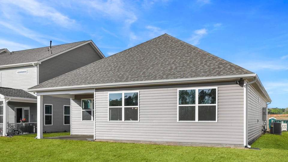 Back exterior with large backyard.