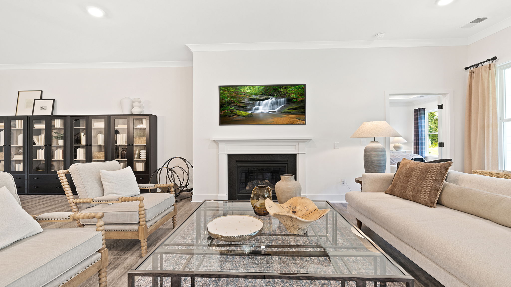 Living room with windows and fireplace.