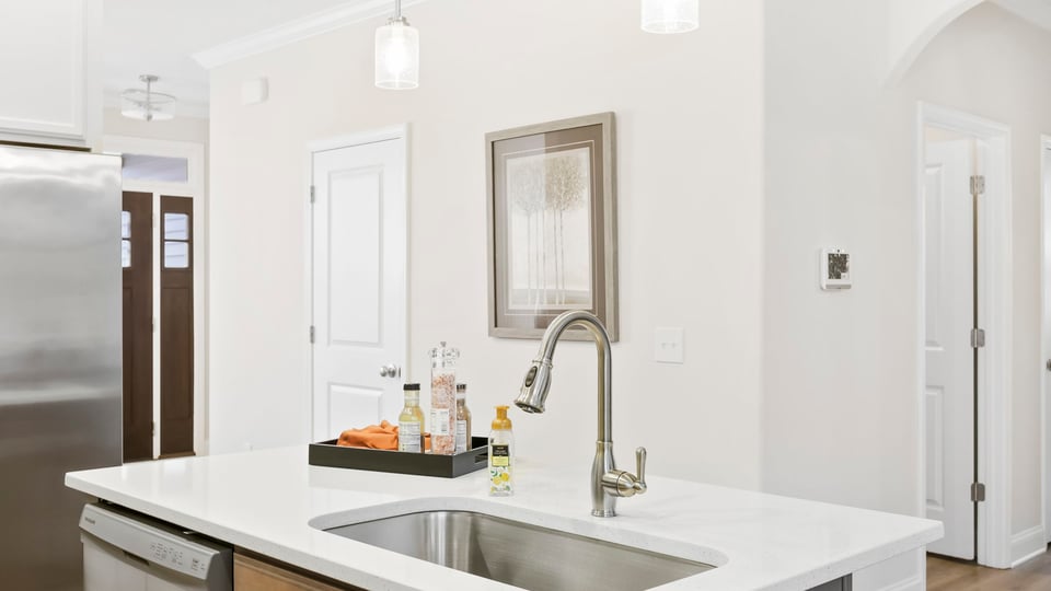 Kitchen with island and cabinets.