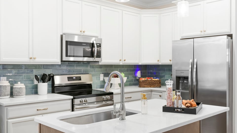 Kitchen with island and cabinets.