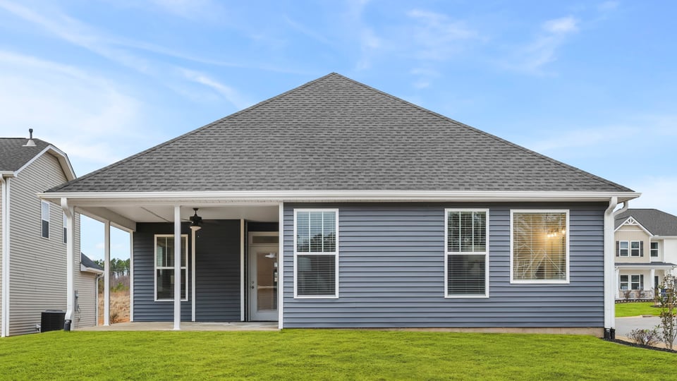 Back exterior with large backyard.