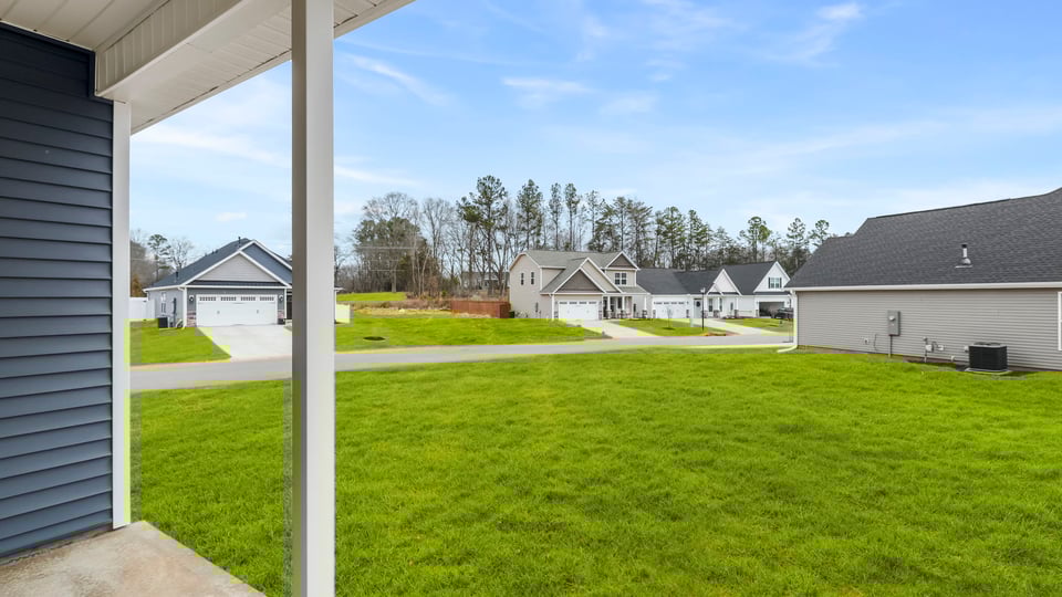 Back exterior with large backyard.