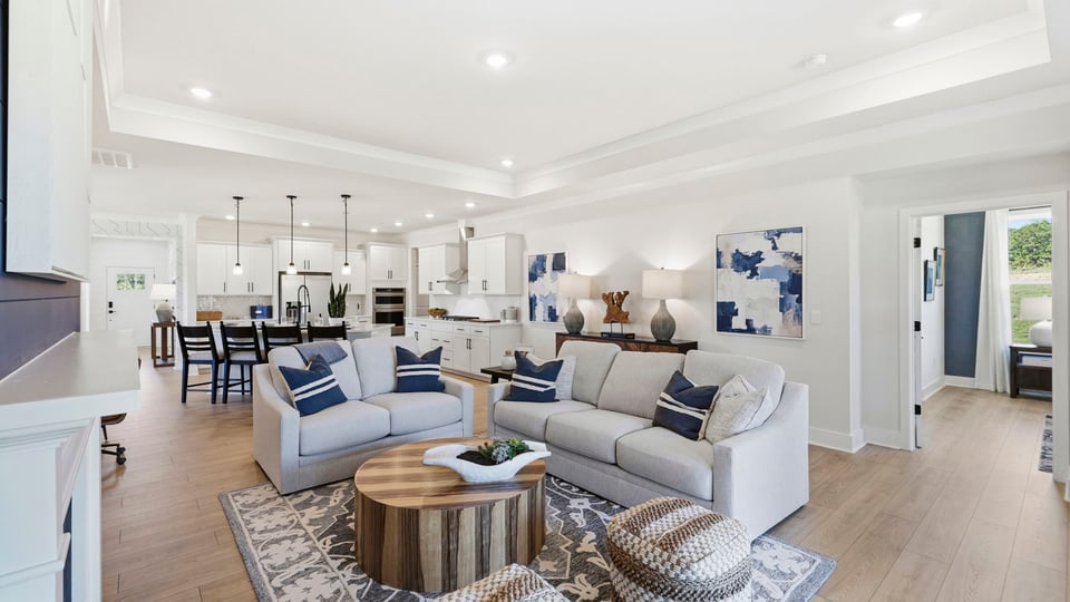 Living area with fireplace and windows.
