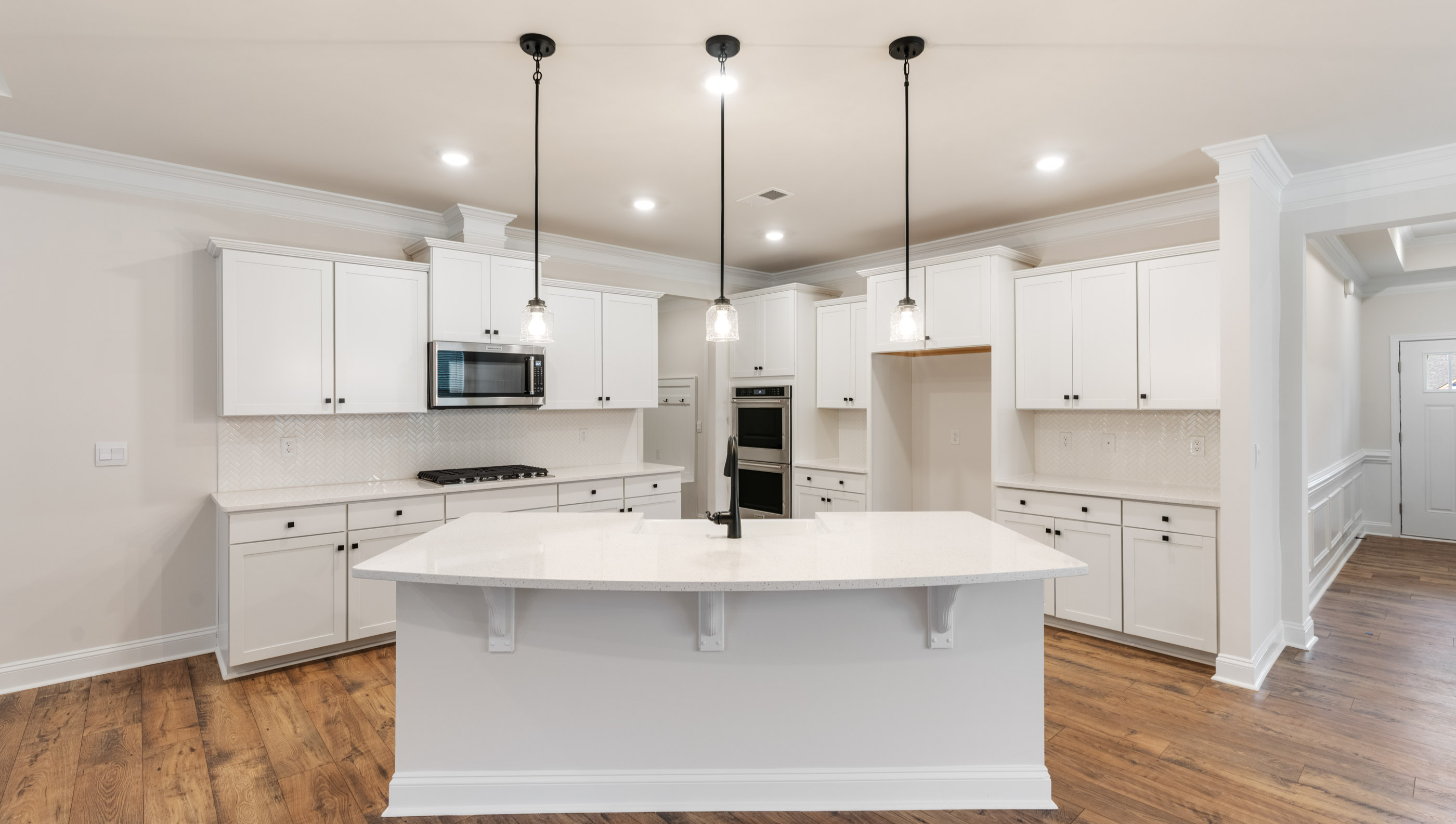 Kitchen with island and cabinets.
