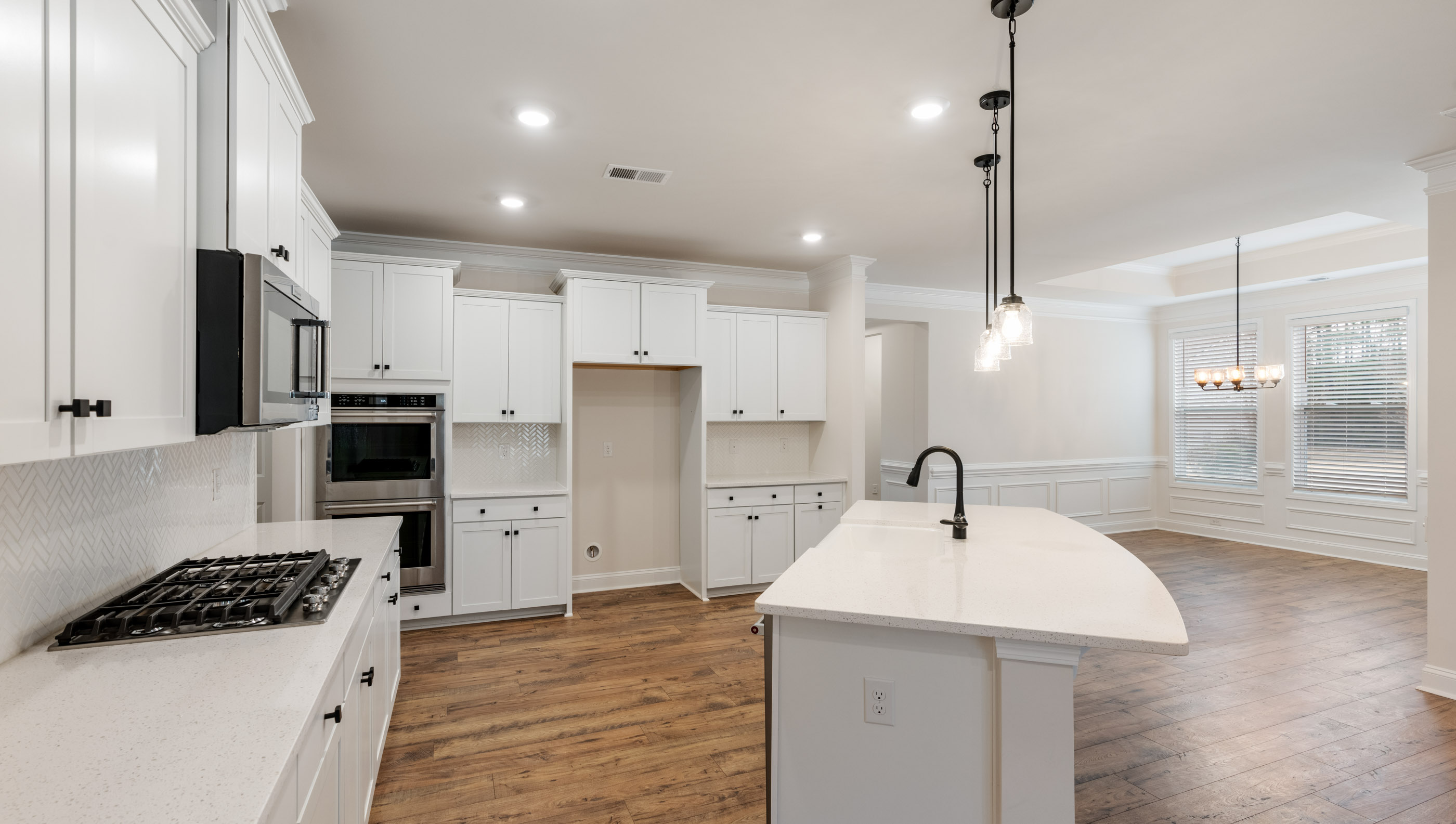 Kitchen with island and cabinets.