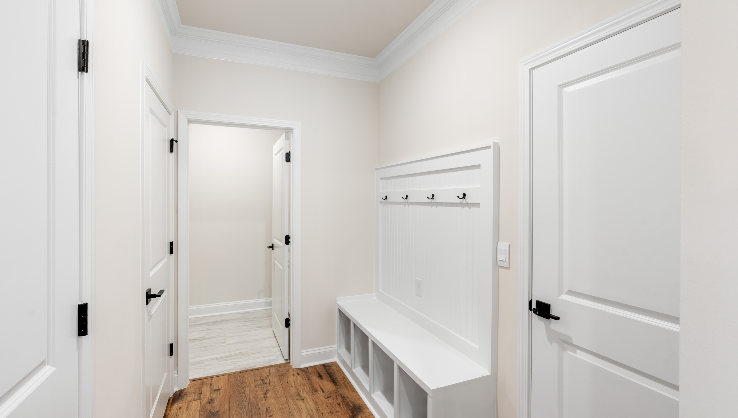 Hallway with storage cabinets.