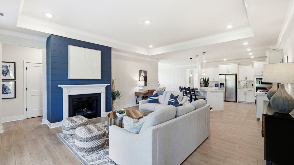Living area with fireplace and windows.