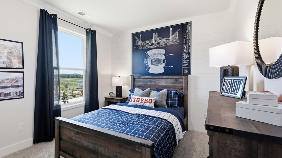 Bedroom with carpet and windows.