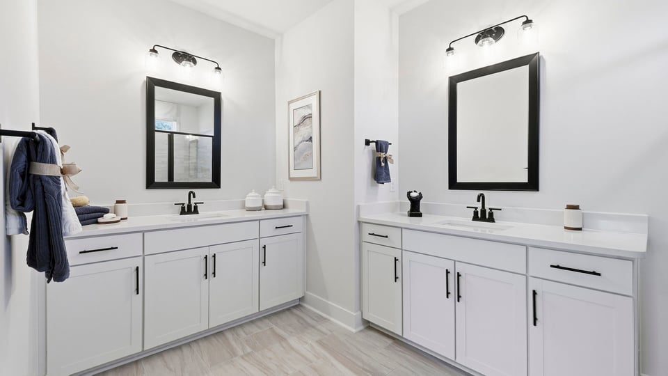 Primary bathroom with double vanity sinks.