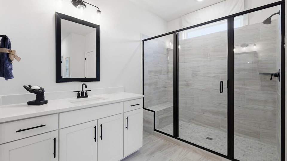 Primary bathroom with double vanity sinks.