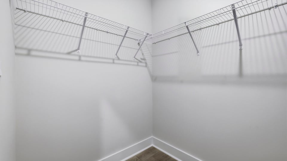 Primary closet with shelf.
