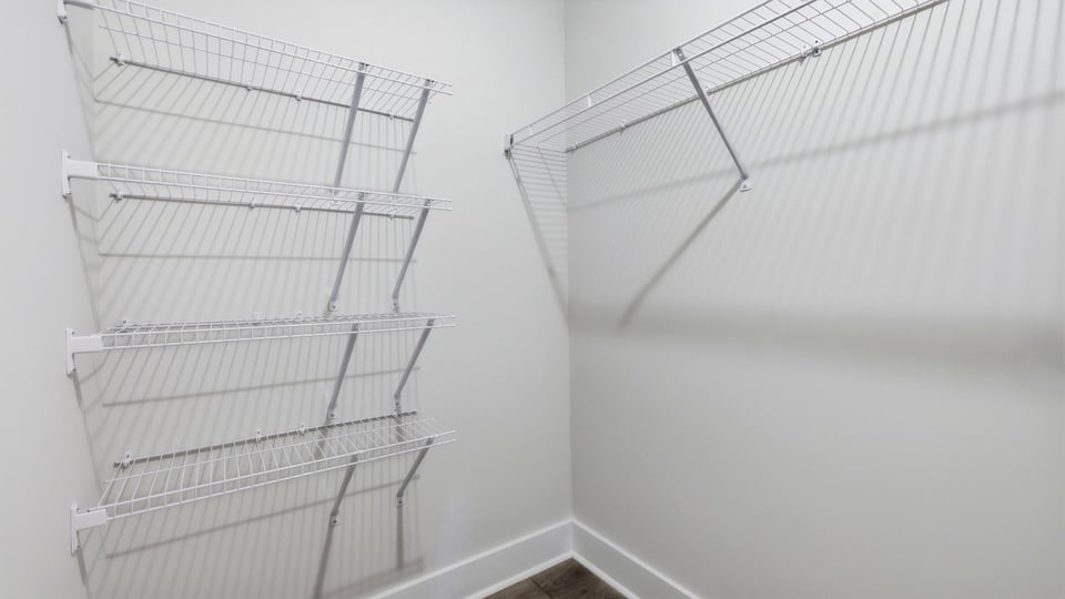 Primary closet with shelf.