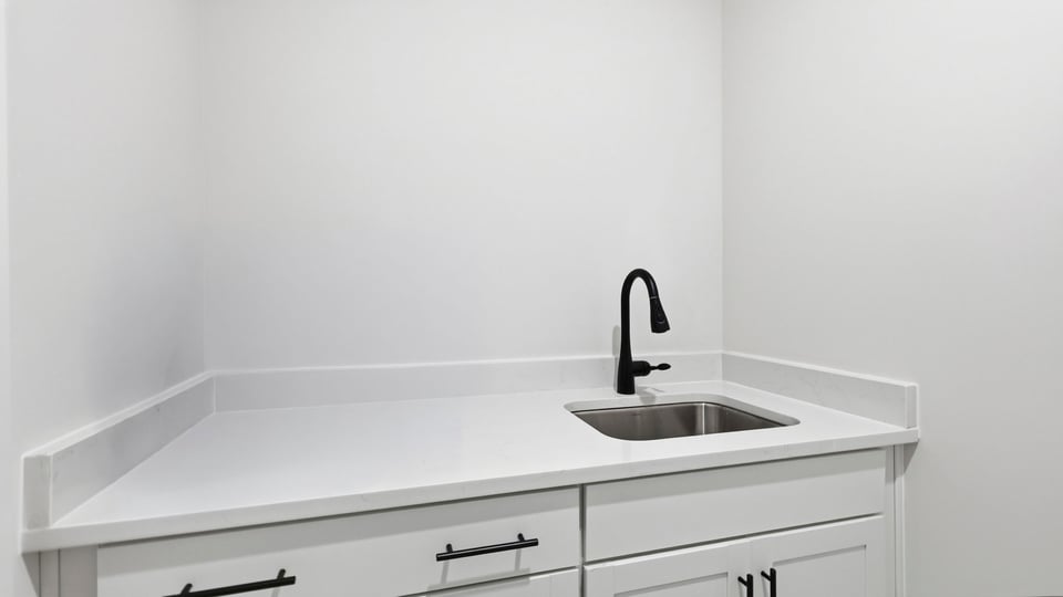 Laundry room with sink.