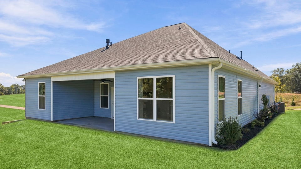 Back exterior with large backyard.