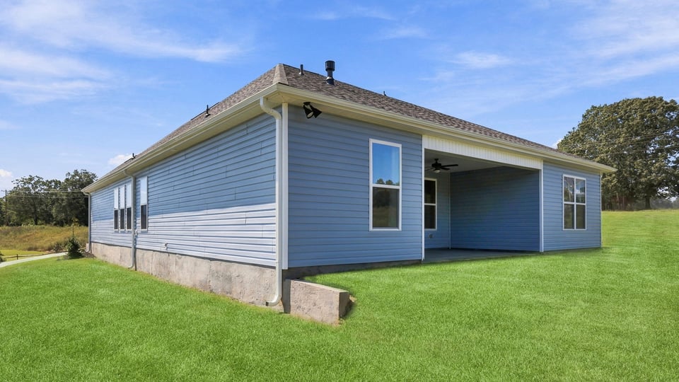 Back exterior with large backyard.